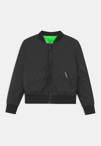 Black bomber jacket made of nylon, featuring a green inner lining, ribbed cuffs, and a front zipper. Includes two side pockets and a logo.