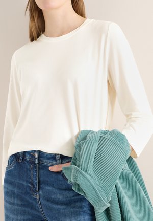 - Bluzka z długim rękawem