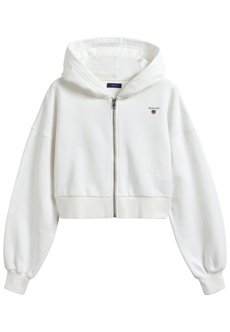 Geknipte witte hoodie van zacht materiaal, met een rits aan de voorkant, lange pofmouwen, geribde boord en een klein logo op de borst.