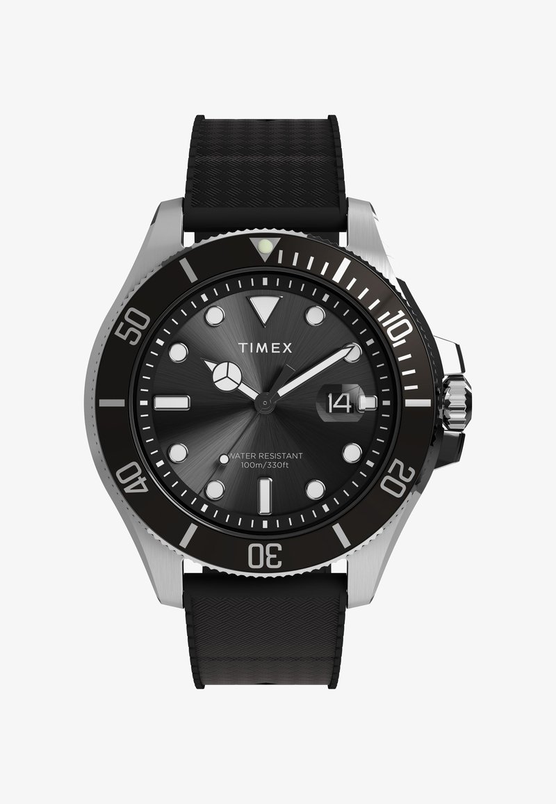 Timexi kell musta tekstuuriga kummirihma, hõbedase korpuse, musta sihverplaadi, helendavate näppude ja 100 m veekindlusega.