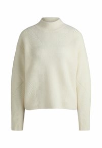 Pull en tricot de couleur crème avec une texture côtelée, un col montant et des manches longues présentant des motifs en tricot diagonaux.