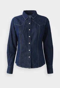 Dark blue denim shirt with long sleeves, pointed collar, front button closure, and decorative stitching along the seams.