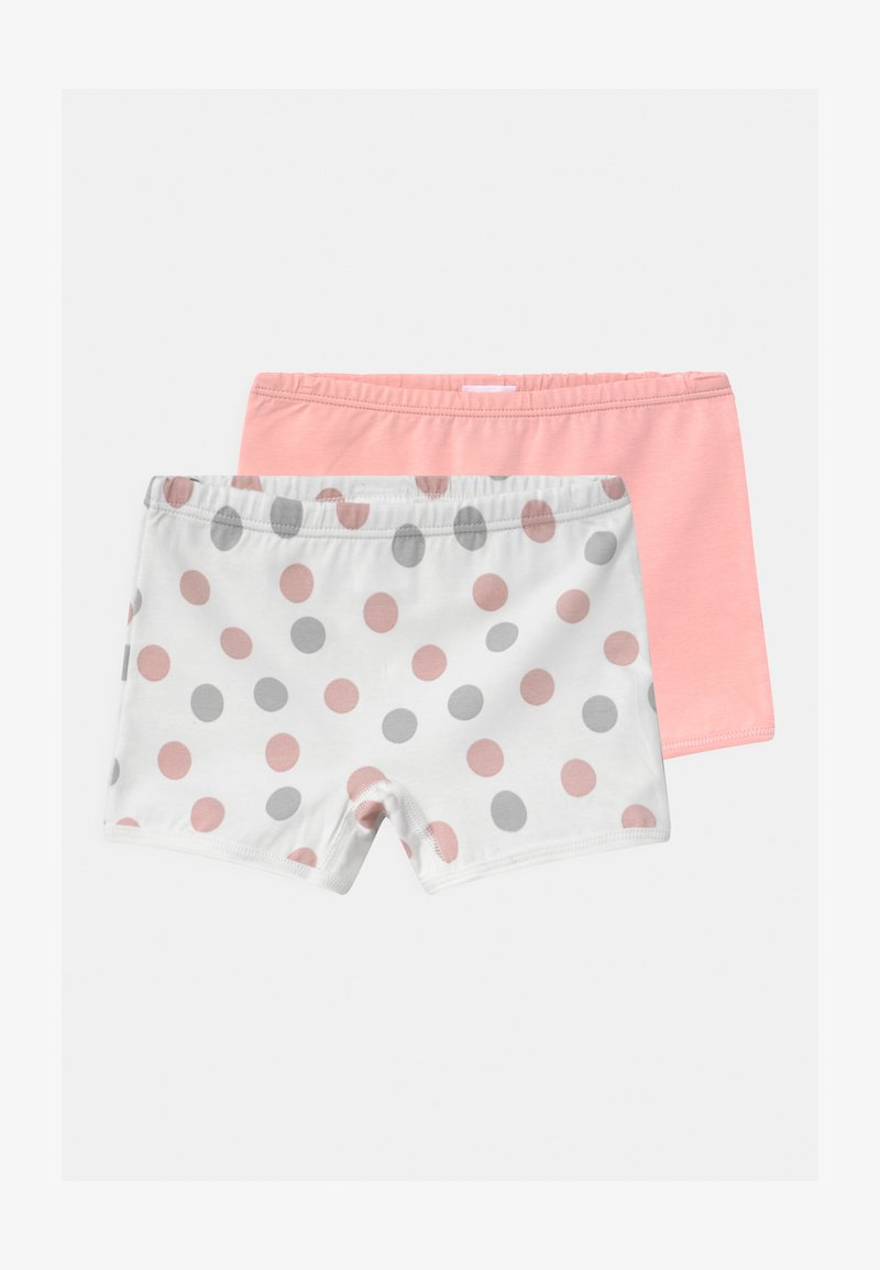 Two pairs of shorts: one solid pastel pink, the other white with pink and gray polka dots. Both feature an elastic waistband and soft fabric.