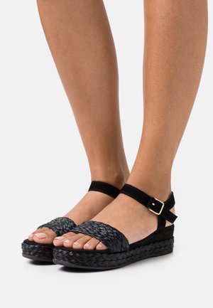 Unisa Sandali con plateau - black