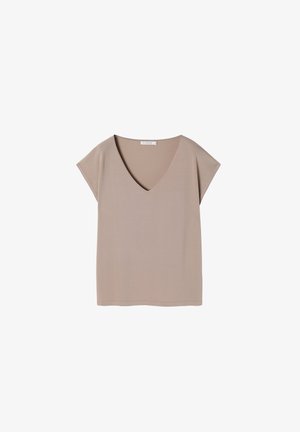 Bež majica s v-neck izrezom i kratkim rukavima, izrađena od mekog materijala. Sadrži jednostavan, ležeran dizajn i ravni rub.