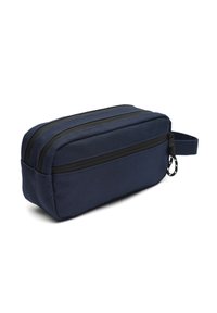 Astuccio rettangolare blu navy con due zip superiori, dettagli neri e una maniglia laterale per un facile trasporto. Tessuto testurizzato.