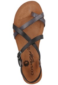 Sandal in pelle nera con molteplici cinturini incrociati, soletta sagomata color beige e fibbia regolabile, con un logo a forma di sole sulla soletta.