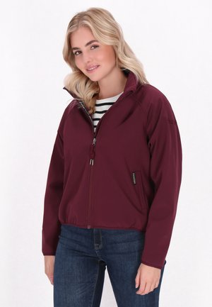 Maroon zip-up jacket with a high collar, elastic cuffs, and a lightweight texture. Worn over a black and white striped top.