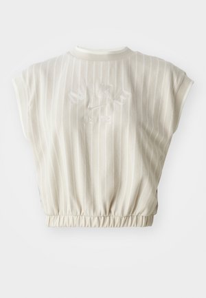 Helles beiges Cropped-Top mit vertikalen Streifen. Rippkragen, elastischer Saum, gesticktes "Nike"-Logo und das Jahr "1972" auf der Rückseite. Weiche Stofftextur.