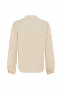 Long-sleeve blouse in light beige, made of smooth fabric. Features gathered puff sleeves and a round neckline. Clean, simple silhouette.