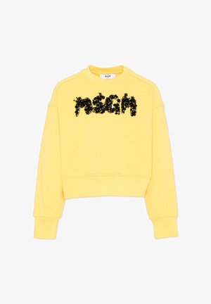 Sweat-shirt jaune court à manches longues avec des ornements floraux noirs formant le mot "MSGM" sur la poitrine.