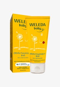 Prodotto Weleda Baby in un tubo e una scatola gialli, con grafiche floreali e testo; contiene calendula bio e timo per il bagnetto del neonato.