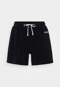 Svarta frottéshorts med elastisk midja och vit dragsko. Har broderad "HUGO"-logotyp på framsidan.