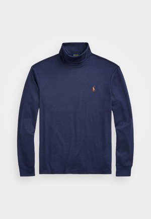 Navyblå tettsittende genser laget av glatt stoff, med lange ermer og en liten brodert logo på brystet.