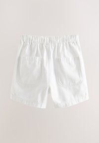 White cotton shorts with an elastic waistband, two back pockets, and a smooth texture. Hem is straight and measured at an average length.