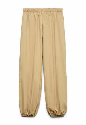 Pantalon beige ample avec taille élastique et poignets élastiques froncés, en tissu léger.