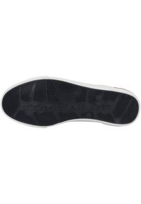 Semelle extérieure en caoutchouc noir avec motif texturé et marquage "TOM TAILOR" ; semelle intermédiaire blanche. Conçue pour l'adhérence et la durabilité.