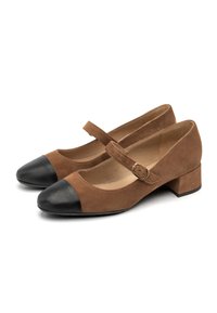 Brown suede Mary Jane shoes with a black leather cap toe, adjustable strap with buckle, and a low block heel. Smooth inner lining.