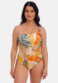 Eén-schouder badpak met een tropisch bladmuster in oranje, geel en groen op een lichtbeige achtergrond; inclusief een decoratieve band.