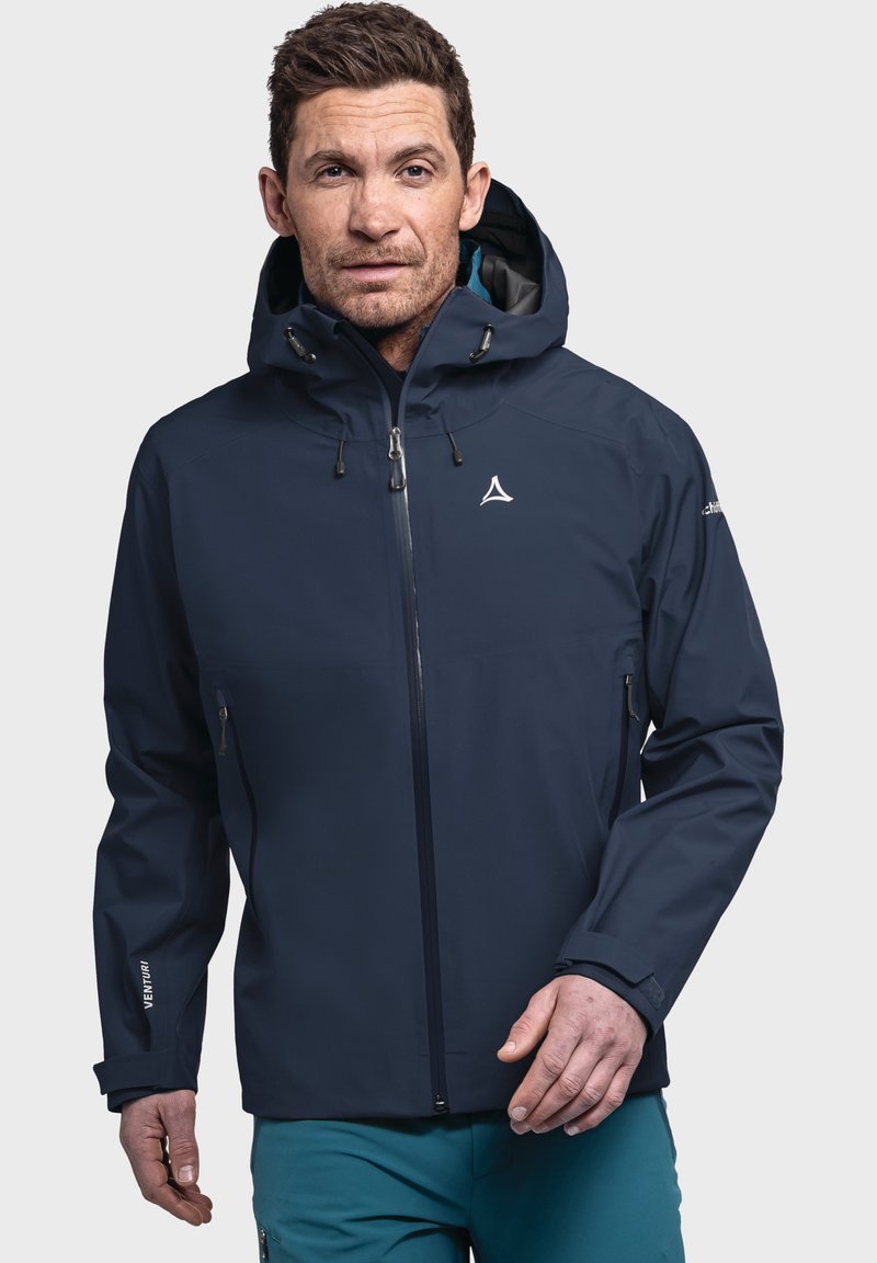 Marineblaues wasserdichtes Jackett mit Kapuze, Frontreißverschluss und verstellbaren Kordeln. Enthält ein Logo auf der Brust und Reißverschlusstaschen.