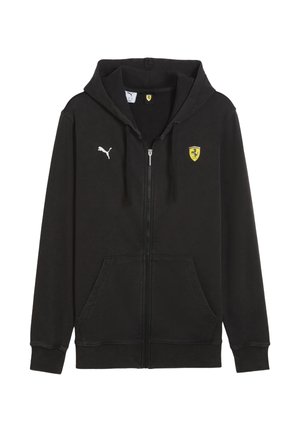 Sudadera negra con cremallera y capucha, hecha de un tejido suave. Presenta un logo blanco de Puma y un escudo amarillo de Ferrari en el pecho. Con bolsillos frontales.