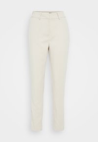 Pantalons cintrés beiges avec une texture lisse, coupe slim, passants de ceinture et jambe légèrement fuselée, présentant un motif tissé subtil.