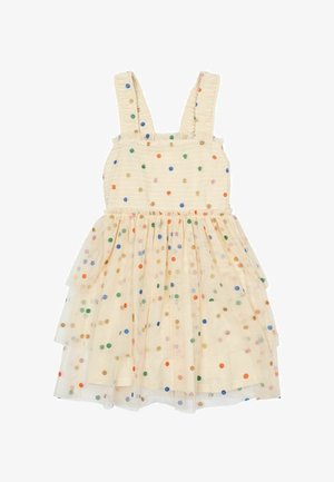 Robe beige clair avec corsage froncé, larges bretelles et jupe en tulle superposée. Présente des pois multicolores sur l'ensemble.
