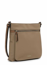 Beige crossbody bag made of synthetic material, featuring a front zip pocket, brown accents, adjustable strap, and a shiny logo detail.