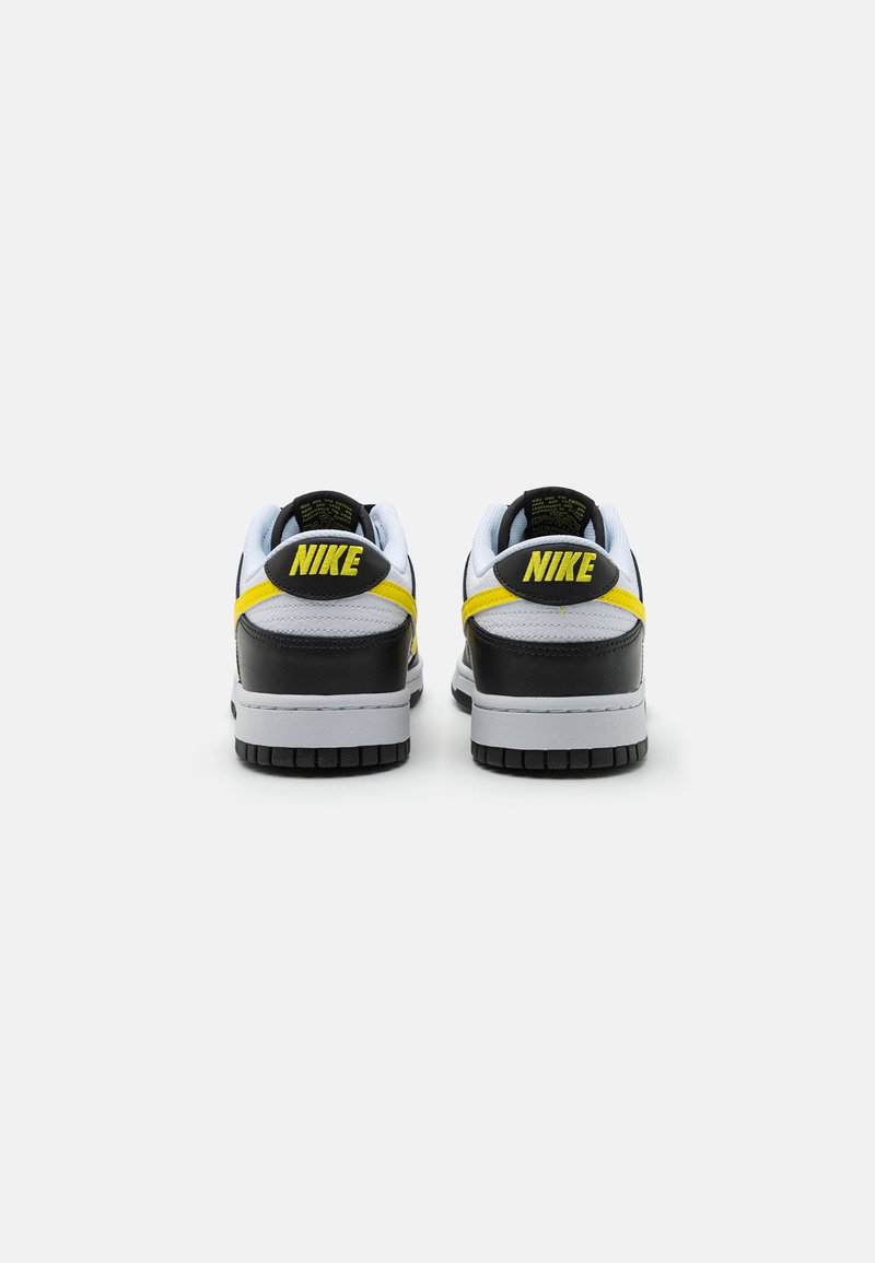 yellow black and white nike dunks