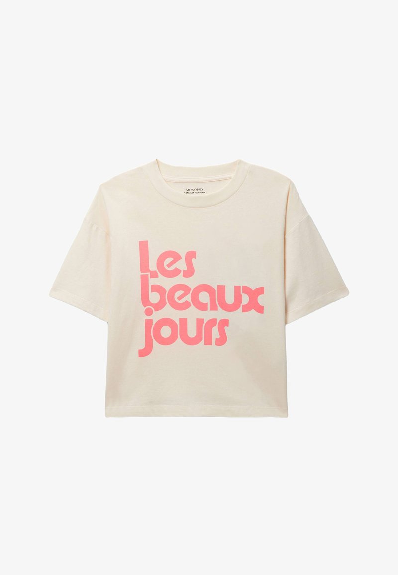 T-shirt court à manches courtes crème avec le texte rose vif "Les beaux jours" sur le devant, en police arrondie et moderne.