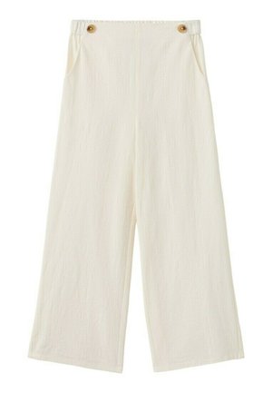 Pantalon ample taille haute couleur crème, en tissu texturé, avec poches avant et deux boutons marron à la taille.