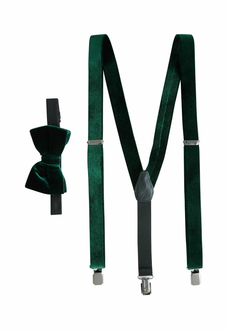 Green velvet suspenders with black adjustable straps, silver clips, and a matching velvet bow tie. Smooth texture, classic design.