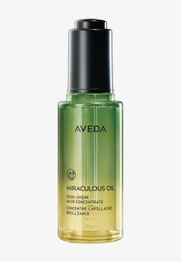 Olio Miracoloso Aveda in una bottiglia di vetro, con un gradiente che sfuma dal verde al giallo, un tappo a pompa nero e testo bianco che etichetta il prodotto.