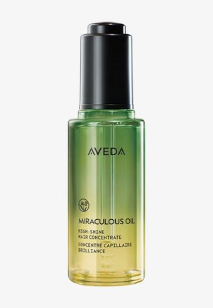L'huile miraculeuse Aveda dans une bouteille en verre, avec un dégradé ombragé allant du vert au jaune, un capuchon noir et un texte blanc indiquant le produit.