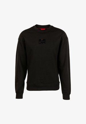Black long-sleeve crewneck sweatshirt with ribbed cuffs and hem, featuring a small rectangular logo patch centered on the chest.