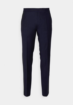 Marineblauwe taps toelopende broek met een gladde textuur, voorzien van een platte voorkant en stiksels aan de zijkant voor een tailor-made uitstraling.