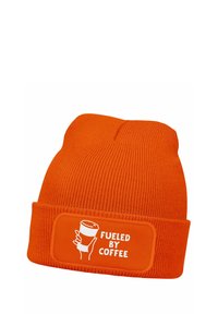 Orange knit beanie with a fold-up cuff featuring a rectangular patch that reads "FUELED BY COFFEE" next to a graphic of a coffee cup.