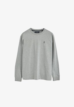 T-shirt grigia a maniche lunghe realizzata in un tessuto misto cotone. Presenta un collo rotondo e un piccolo logo sul petto. Design semplice.