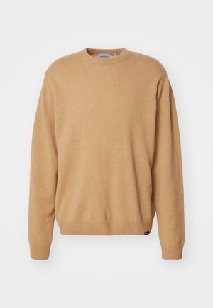 Maglione beige lavorato a maglia con scollatura rotonda, maniche lunghe e polsini e orlo a costine. Texture morbida con un'etichetta dettagliata sul fondo.