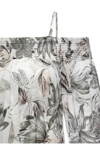 Blumenmusterstoff in Beige- und Grautönen. Mit geschmücktem Oberteil und verstellbaren Trägern. Leichter, strukturierten Leinenmix.