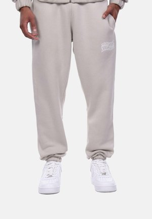 Dropsize HEAVY MIRRORED LOGO JOGGER - Tracksuit bottoms - stone