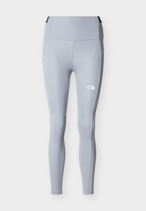 Leggings de longitud completa en gris claro con cintura alta y logo blanco de The North Face en el muslo izquierdo.
