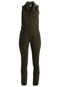 Combinaison vert olive sans manches, avec deux poches poitrine et une silhouette ajustée. Fabriquée dans un tissu durable à la texture lisse.