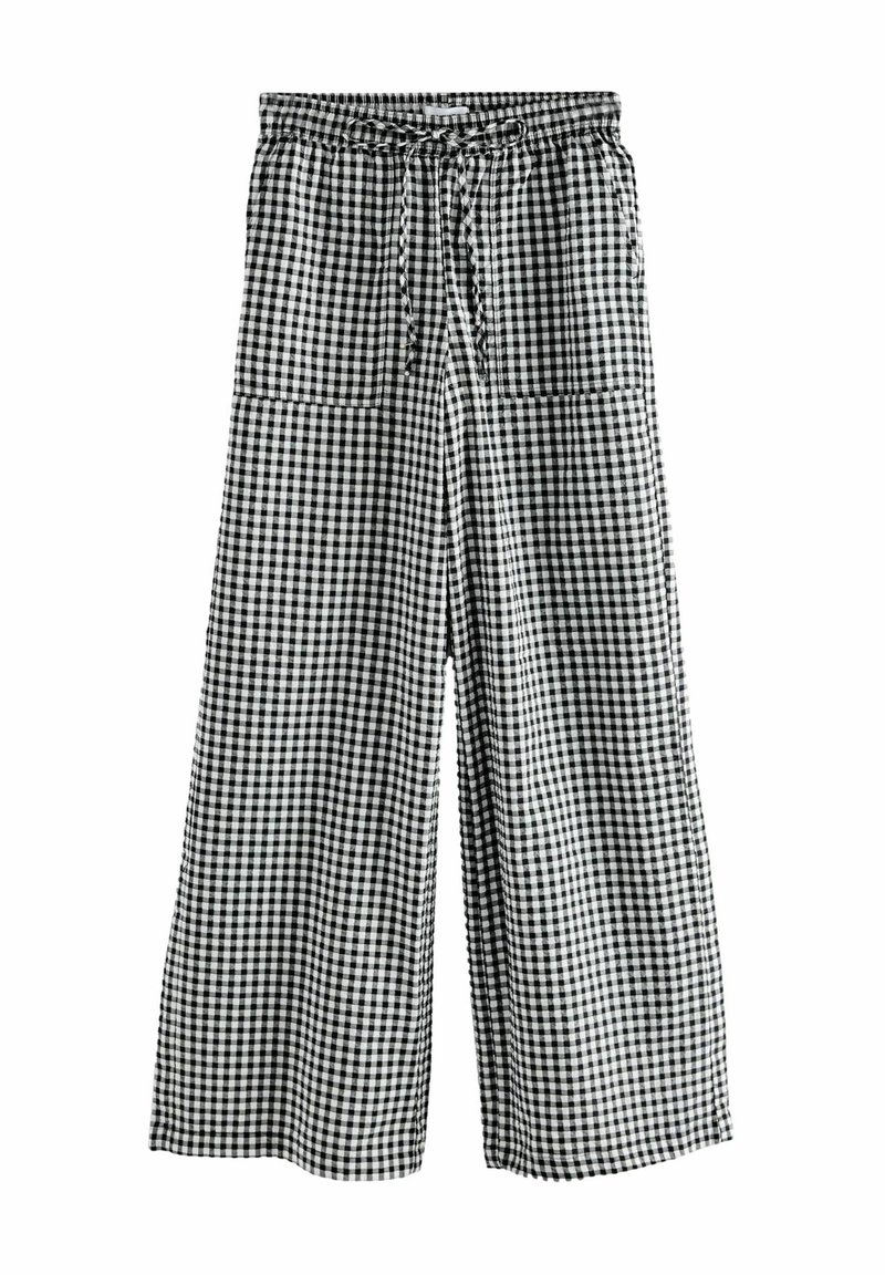 Pantalon large à carreaux vichy noir et blanc avec ceinture élastique et cordon devant, avec deux poches plaquées à l'avant.