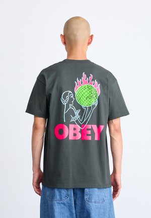 Gray cotton t-shirt featuring a colorful back graphic of a figure holding a globe, with pink and blue accents and bold "OBEY" text.