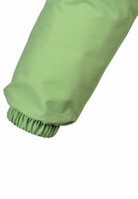 Ljusgrön jackärm med elastiskt manschett, tillverkad av ett glatt, något glänsande tyg. Har en minimalistisk design utan synliga mönster.