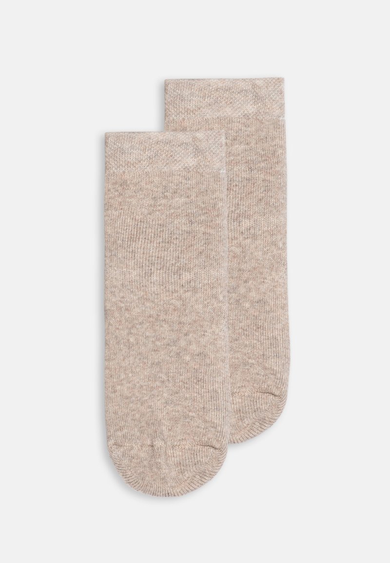 Calze lunghe fino al ginocchio in un leggero color beige, realizzate in un morbido materiale testurizzato con un sottile motivo melangiato e punta e tallone rinforzati.