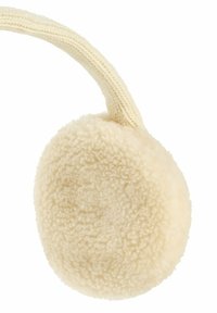 Rond, coussin d'oreilles en crème, présentant une texture douce et duveteuse ainsi qu'une sangle tricotée pour un maintien sûr.