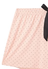 Gonna di stoffa rosa con pois neri, vita elasticizzata e un nastro nero di accentuazione sul lato. Tessuto morbido e design casual.