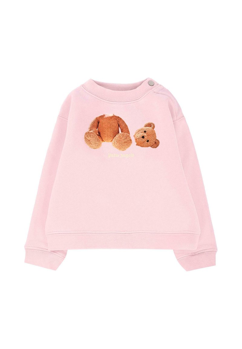 Sweatshirt rose avec un col rond et des manches longues. Présente un graphique en peluche texturé d'ours et le nom de la marque "Palm Angels" en jaune.
